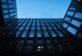 An AI illustration of a view of several different modern buildings at night from the ground