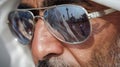 AI image, Arab man in sunglasses reflecting the city view for travel and culture theme concept Royalty Free Stock Photo