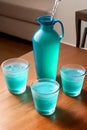 AI photo of three glasses filled with water and a jug of water.