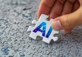 AI puzzle piece concept with hand fitting technology piece digital puzzle Royalty Free Stock Photo