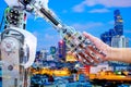 AI Robot handshake with human for join on teamwork Royalty Free Stock Photo