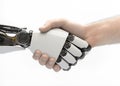 AI robot and human shaking hands. A handshake between a white robotic cyborg hand and a human hand, on a white background.