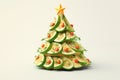 Sandwich - toast in the shape of Christmas tree made of lime slices, tomatoes and dill on a white background. Table decoration Royalty Free Stock Photo