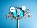 AI searching tools, development and management technology assistance service support concept. Robot face in magnifying glass lens