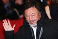 Ai Weiwei poses on the red carpet