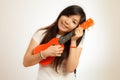 Aian woman enjoy her Ukulele Royalty Free Stock Photo