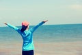 Aian woman open arms at seaside Royalty Free Stock Photo