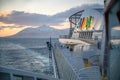 AIDA Bella on the sea in front of Iceland with snow mountain in background, Colorful Aida Logo and cruise ship in front Royalty Free Stock Photo