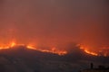 Large forest wildfire at night