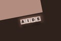 AIDS letters on wooden cubes. STD sexually transmitted diseases