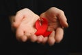 Aids ribbon on hands, hiv Royalty Free Stock Photo