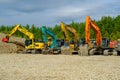 Aidu, Estonia - August 27, 2023: A lot of different tractors have gathered in one place. Quarry heavy tractor equipment