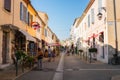 Aigues-Mortes, France - July 21, 2017: cozy street in old town inside the ancient city wall, South France Royalty Free Stock Photo