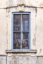 A blue framed window on an old building Royalty Free Stock Photo