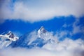 Aiguille de Bionnassay peak of Mont Blanc massif in clouds