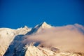 Aiguille de Bionnassay peak of Mont Blanc in sunset clouds