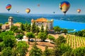 Aiguines castle and St Croix lake with hot air balloons Royalty Free Stock Photo