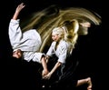 Aikido budokas man and woman isolated black background