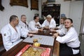 Aikido instructors having brake at sport club cafe