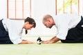 Aikido martial arts teacher and student take a bow Royalty Free Stock Photo