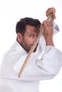 Aikido master with wood sword in defensive position