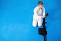 An aikidoka girl folding her hakama for Aikido Royalty Free Stock Photo