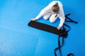 An aikidoka girl folding her hakama for Aikido Royalty Free Stock Photo