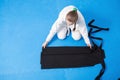 An aikidoka girl folding her hakama for Aikido training Royalty Free Stock Photo