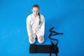 An aikidoka girl folding her hakama for Aikido training Royalty Free Stock Photo