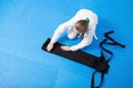 An aikidoka girl folding her hakama for Aikido training Royalty Free Stock Photo