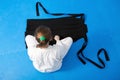 An aikidoka girl folding her hakama for Aikido training Royalty Free Stock Photo