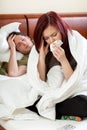 Ailing couple in bedroom Royalty Free Stock Photo