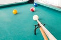 Aiming ball using extender stick during snooker billards game Royalty Free Stock Photo