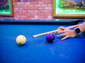 Hands aiming white ball to shot close up Royalty Free Stock Photo