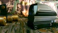 Aims red dot sight, ammunition and bandoleer on a camouflage background, wallpaper