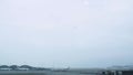 Aiplane flying in sky for landing in airpot terminal in Hong Kong city, China. Passenger aircraft flying in cloudy sky