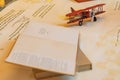 Aiplane over map and book