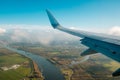 Aiplane wing, landscape aerial and blue sky