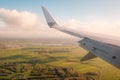 Aiplane wing, landscape aerial and blue sky