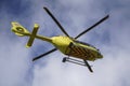 The air ambulance, service rush to the scene of an accident. Flying yellow medical ambulance helicopter.