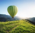 Air ballon above mountains at the summer time.