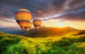 Air ballons above mountains at the summer time. Royalty Free Stock Photo