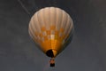 Air balloon with bright burning flame flying in the night