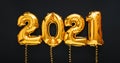 2021 air balloon gold text with ribbons on black background. Happy New year eve invitation with Christmas gold foil balloons 2021 Royalty Free Stock Photo