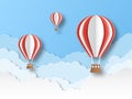 Air balloon paper cut. Colourful flying balloons in blue sky with white clouds. Airship travel 3d origami cartoon vector