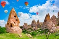 Air balloons in Cappadocia-the ancient Uchisar Castle fortress