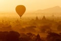 Air balloons over Buddhist temples at sunrise. Bagan, Myanmar. Royalty Free Stock Photo