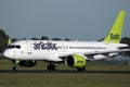 AirBaltic jet plane taxiing in airport