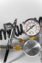Air brush with pressure gauge and pipes. Royalty Free Stock Photo