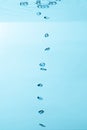 Air bubble and water splash,Water splash isolated on blue background Royalty Free Stock Photo